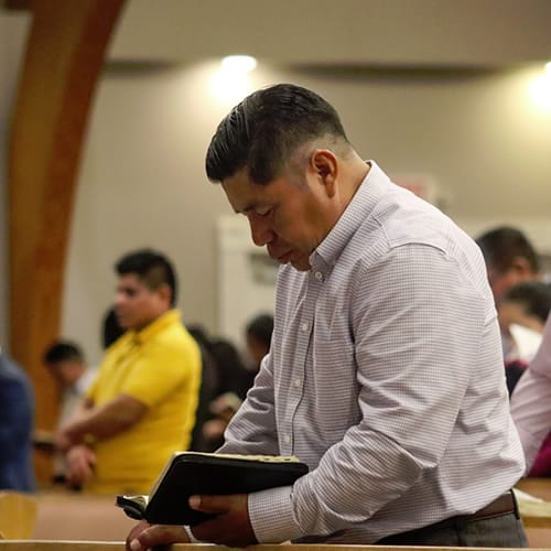 US Spanish Ministries department at Hope International Missions Man looking at a Bible